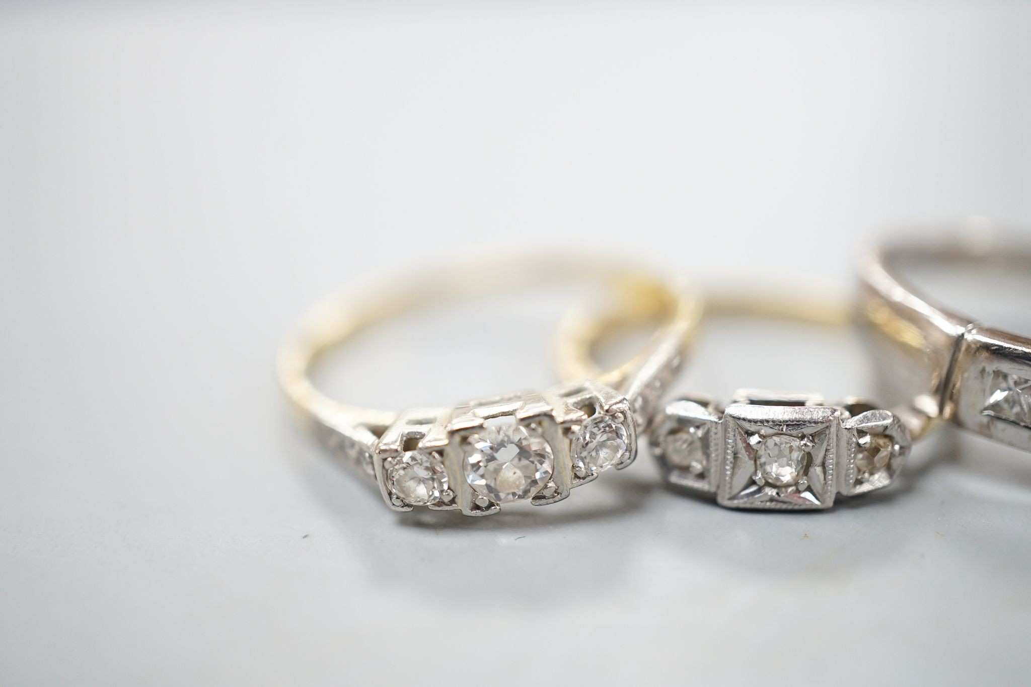 Four assorted diamond dress rings including two 18ct and two white metal, gross 10 grams